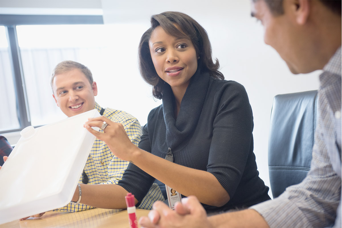 Three Associates talking in a meeting